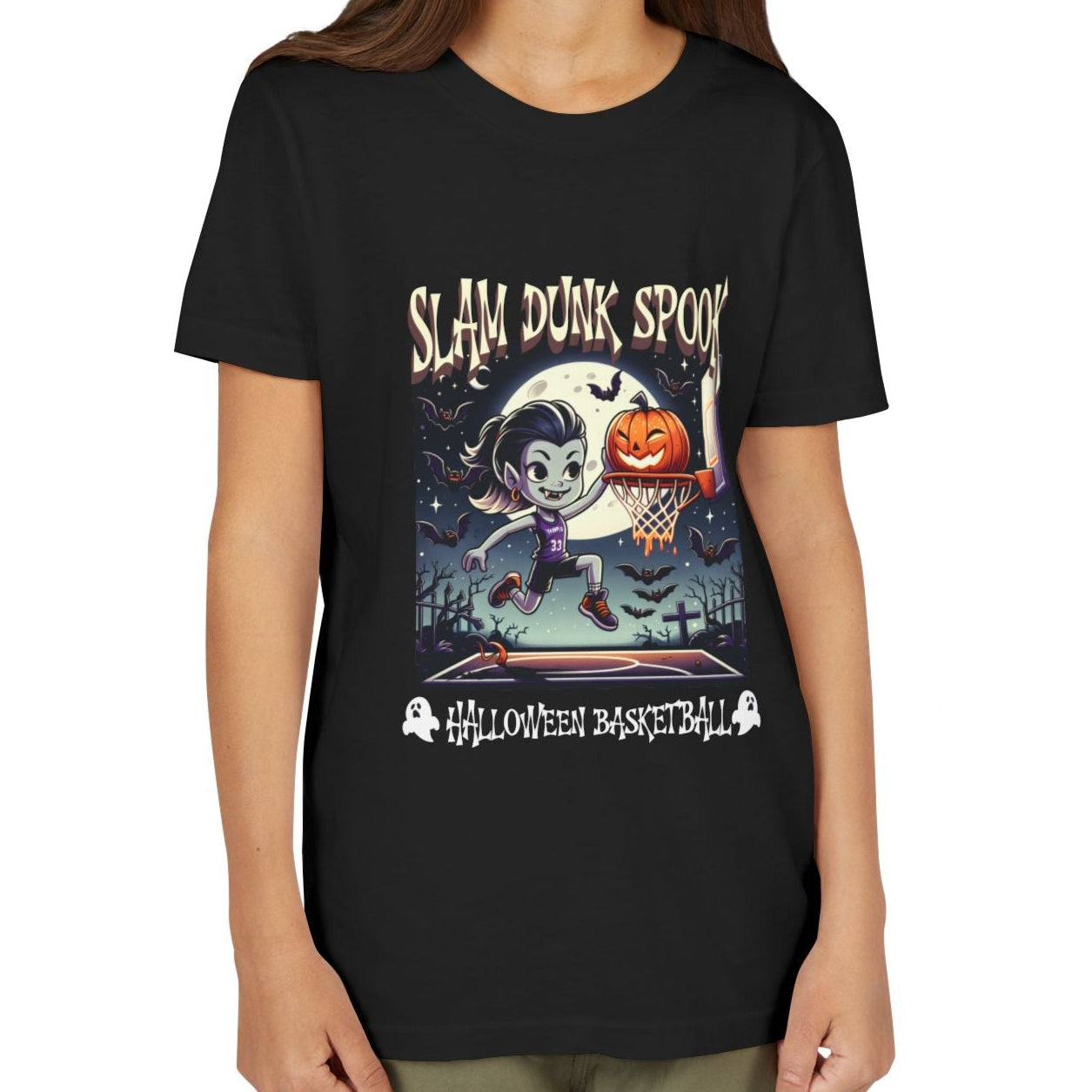 Child wearing a black t-shirt with Halloween-themed design on a white background